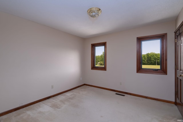 4431 Mccomb Rd, Huntertown, IN 46748 - spare room with plenty of natural light, light colored carpet, and baseboards