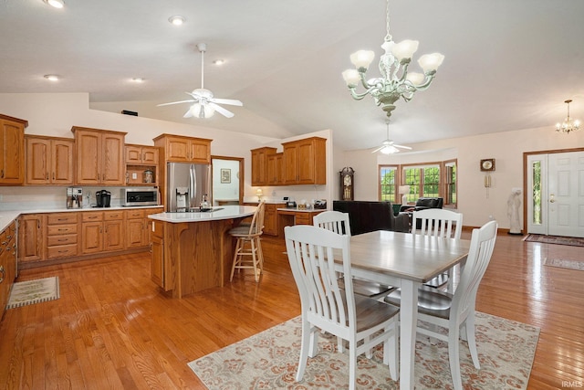 2617 W Union St, Claypool, IN 46510 - dining area featuring a chandelier, a ceiling fan, light wood finished floors, and lofted ceiling