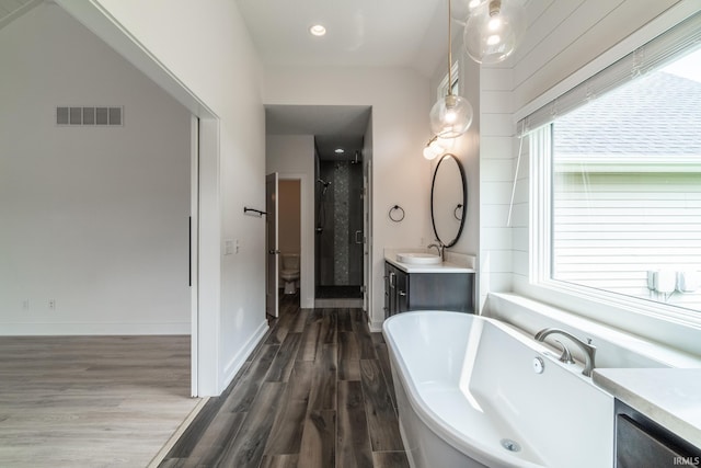 119 Artisan Pass, Fort Wayne, IN 46845 - full bathroom with a freestanding tub, vanity, wood finished floors, and a stall shower