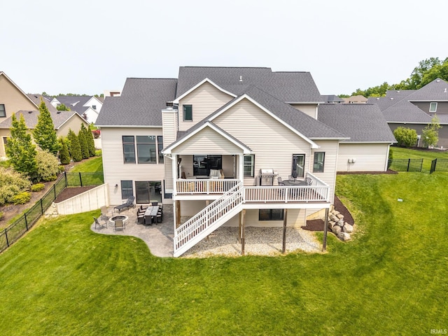 119 Artisan Pass, Fort Wayne, IN 46845 - back of property featuring an outdoor fire pit, a deck, a patio area, stairway, and a shingled roof