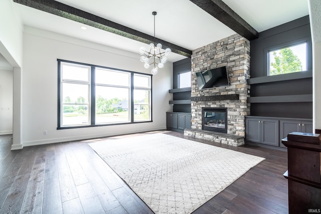 119 Artisan Pass, Fort Wayne, IN 46845 - unfurnished living room featuring plenty of natural light, beam ceiling, dark wood-style flooring, baseboards, and a chandelier