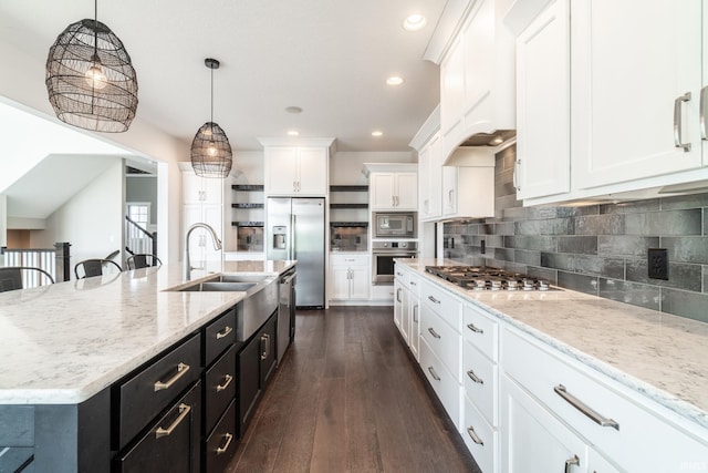 119 Artisan Pass, Fort Wayne, IN 46845 - kitchen featuring appliances with stainless steel finishes, white cabinetry, dark cabinetry, open shelves, and hanging light fixtures