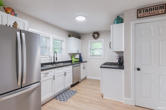1409 Miner St, South Bend, IN 46617 - kitchen featuring appliances with stainless steel finishes, a sink, healthy amount of natural light, and dark countertops