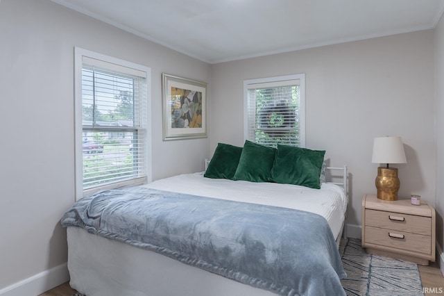 1409 Miner St, South Bend, IN 46617 - bedroom with crown molding, light wood finished floors, and baseboards