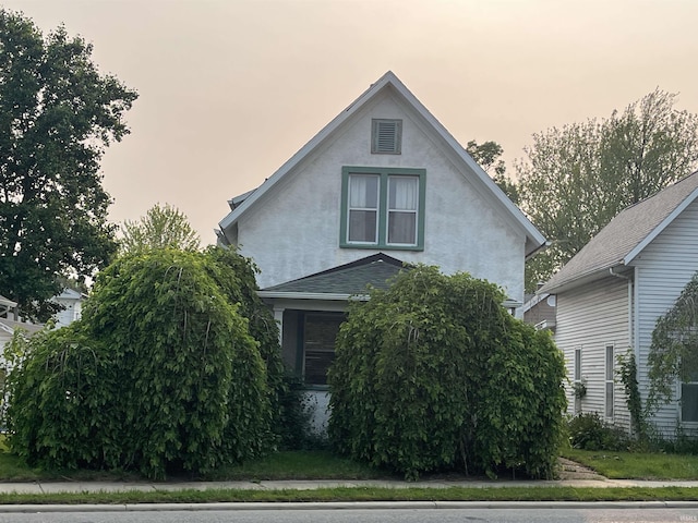 617 S Main St, Goshen, IN 46526 - view of front of property with stucco siding and roof with shingles