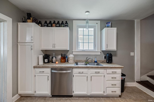 1706 Pierce St, Lafayette, IN 47905 - kitchen with dishwasher, a sink, baseboards, white cabinets, and light countertops