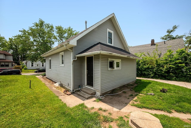 1706 Pierce St, Lafayette, IN 47905 - view of home's exterior featuring entry steps and a lawn