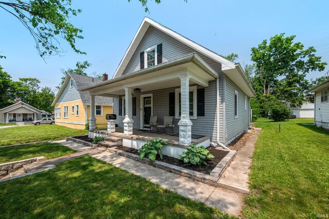 1706 Pierce St, Lafayette, IN 47905 - view of front facade featuring covered porch and a front lawn