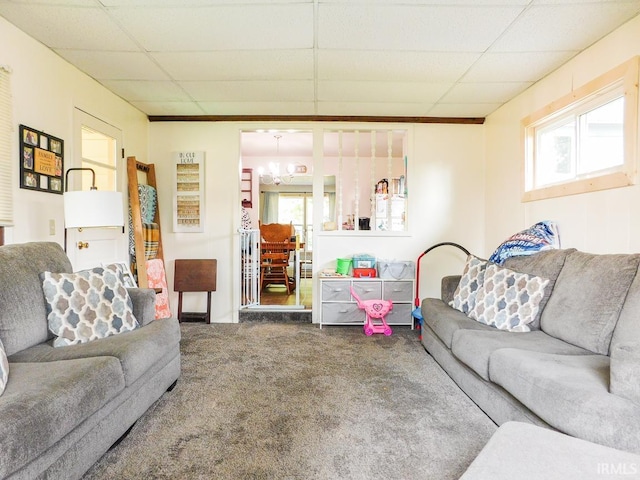 2363 N Oak Dr, Bluffton, IN 46714 - carpeted living area featuring a chandelier, a paneled ceiling, and healthy amount of natural light