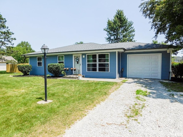2363 N Oak Dr, Bluffton, IN 46714 - single story home featuring a garage, gravel driveway, and a front yard