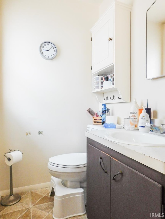 2363 N Oak Dr, Bluffton, IN 46714 - half bathroom featuring vanity and tile patterned flooring
