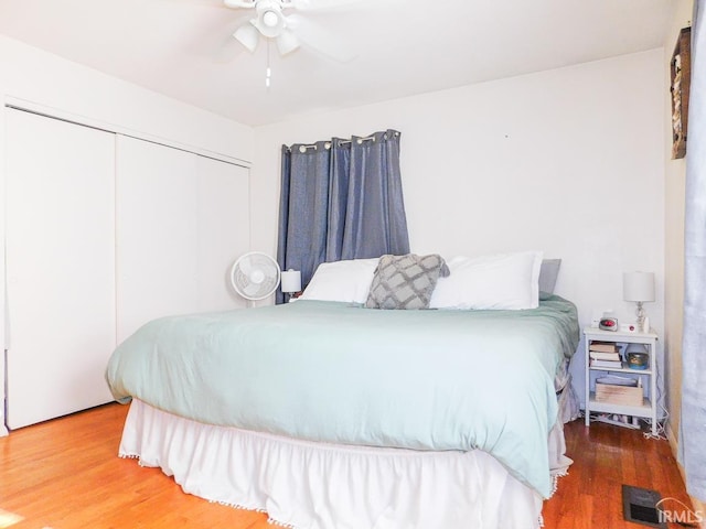 2363 N Oak Dr, Bluffton, IN 46714 - bedroom with a closet, wood finished floors, and a ceiling fan