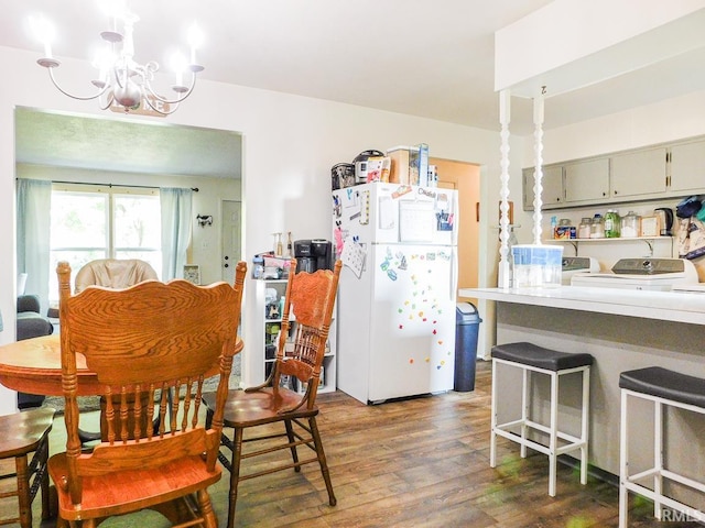 2363 N Oak Dr, Bluffton, IN 46714 - dining room with wood finished floors, a chandelier, and washer and clothes dryer