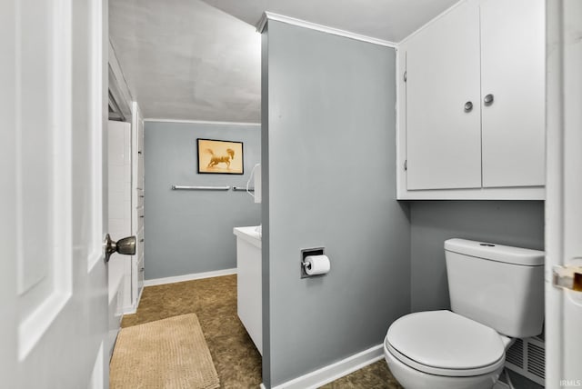 708 E Center St, Warsaw, IN 46580 - bathroom featuring toilet, vanity, and baseboards