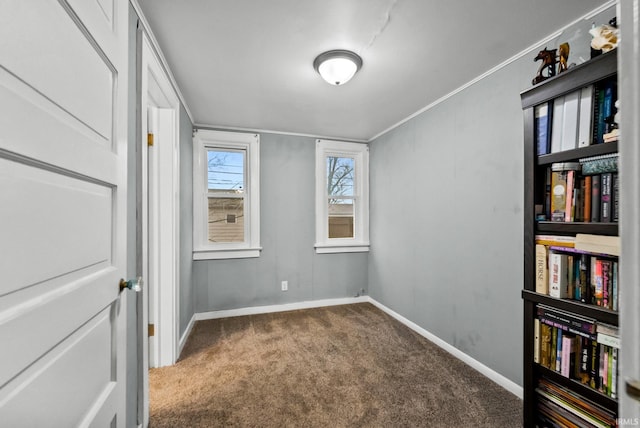 708 E Center St, Warsaw, IN 46580 - carpeted spare room featuring baseboards and crown molding