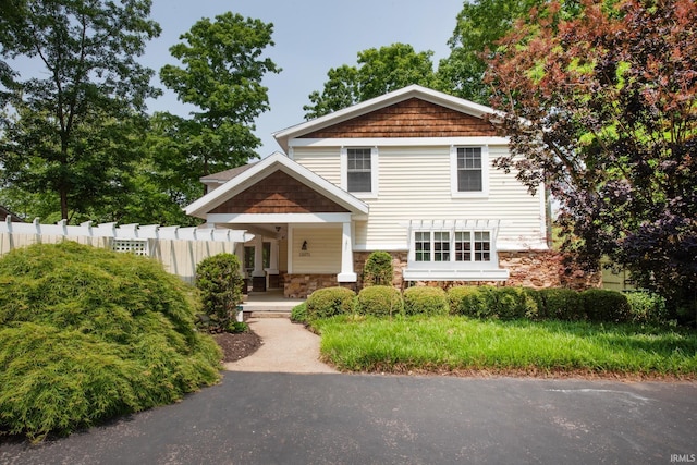 12071 W Tecumseh Bend Rd, Brookston, IN 47923 - view of front of home with stone siding and a porch
