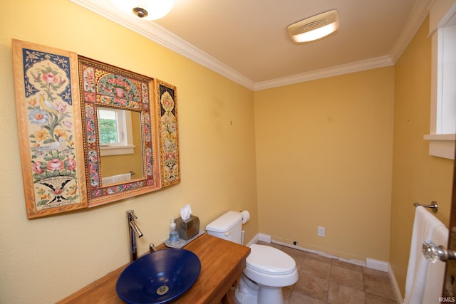 12071 W Tecumseh Bend Rd, Brookston, IN 47923 - half bathroom with a sink, toilet, crown molding, and baseboards