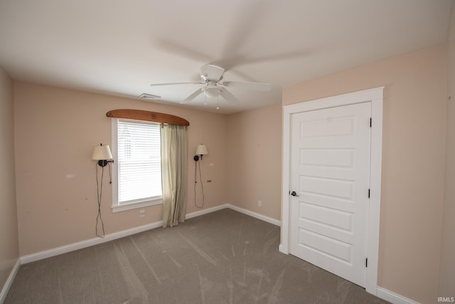 12071 W Tecumseh Bend Rd, Brookston, IN 47923 - unfurnished room with a ceiling fan, baseboards, and carpet