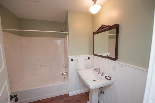 12071 W Tecumseh Bend Rd, Brookston, IN 47923 - full bathroom with wainscoting, wood finished floors, and shower / bath combination