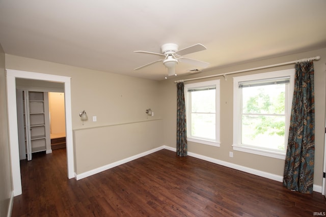 12071 W Tecumseh Bend Rd, Brookston, IN 47923 - spare room featuring a ceiling fan, baseboards, and dark wood-style flooring