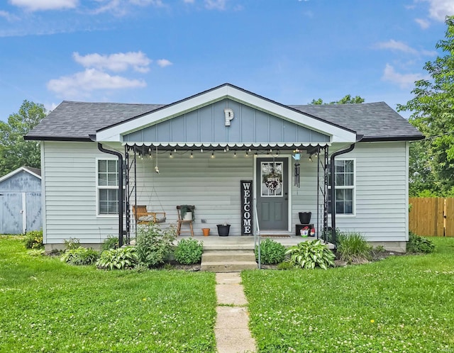 160 SW 5th St, Linton, IN 47441 - view of front of property with covered porch, board and batten siding, and roof with shingles