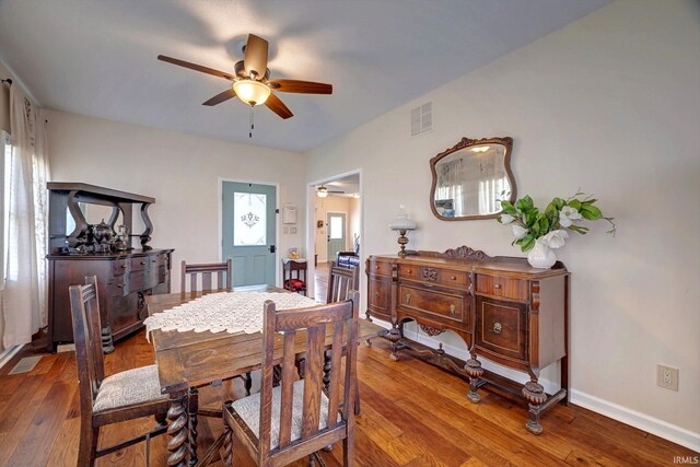 210 W Main St, Worthington, IN 47471 - dining area featuring a ceiling fan, hardwood / wood-style floors, and baseboards