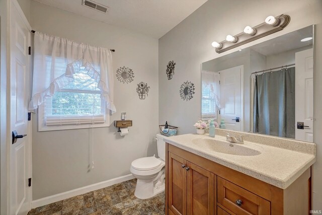 210 W Main St, Worthington, IN 47471 - full bath with vanity, baseboards, and toilet