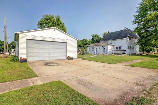 210 W Main St, Worthington, IN 47471 - view of front of property featuring a detached garage, an outdoor structure, and a front yard