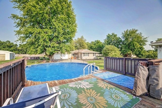 210 W Main St, Worthington, IN 47471 - view of swimming pool featuring a deck and view of wooded area