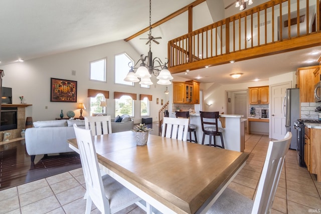 4609 N Sheldon Dr, Churubusco, IN 46723 - dining room featuring light tile patterned flooring, a chandelier, and high vaulted ceiling