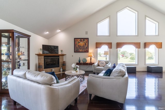4609 N Sheldon Dr, Churubusco, IN 46723 - living room featuring a tile fireplace, high vaulted ceiling, and dark wood finished floors
