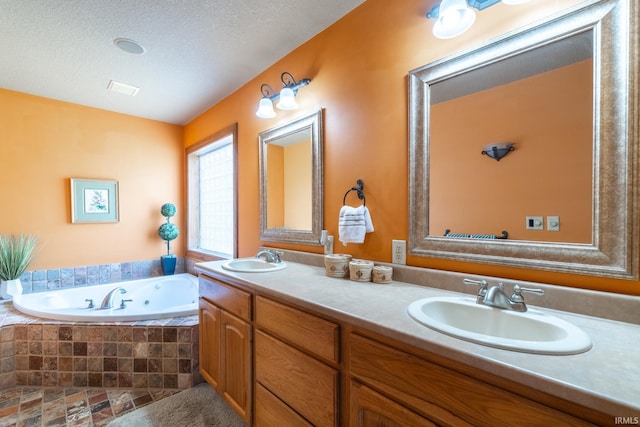 4609 N Sheldon Dr, Churubusco, IN 46723 - full bathroom with a whirlpool tub, double vanity, and a textured ceiling