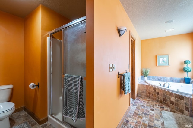 4609 N Sheldon Dr, Churubusco, IN 46723 - bathroom featuring toilet, a jetted tub, a shower stall, baseboards, and a textured ceiling