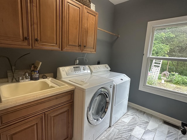 8284 S Mackenzie Ct, Bloomington, IN 47401 - washroom with washer and dryer, cabinet space, and baseboards