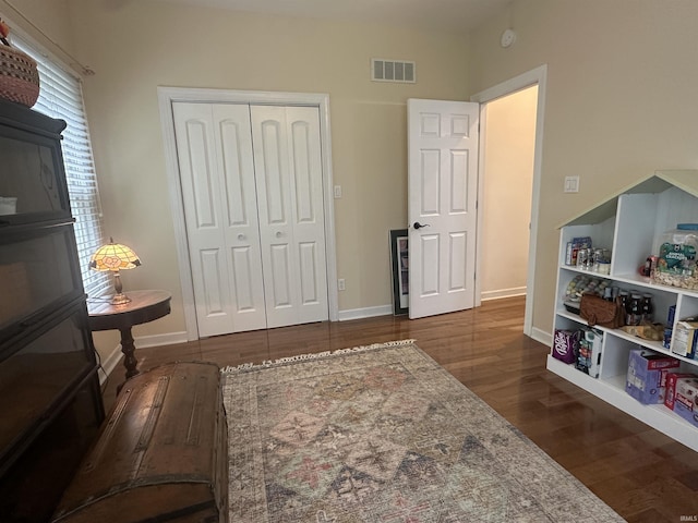 8284 S Mackenzie Ct, Bloomington, IN 47401 - playroom with wood finished floors and baseboards