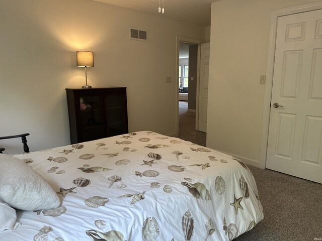 8284 S Mackenzie Ct, Bloomington, IN 47401 - bedroom featuring carpet floors