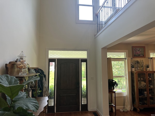 8284 S Mackenzie Ct, Bloomington, IN 47401 - foyer with a towering ceiling, wood finished floors, and baseboards