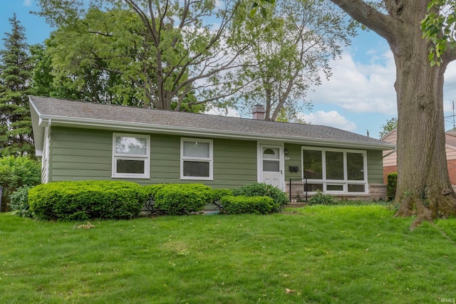 3314 Whitcomb Ave, South Bend, IN 46614 - view of front of home with a front lawn and a chimney