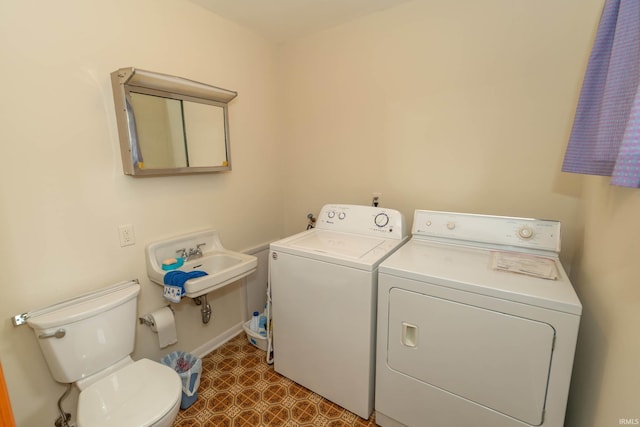3314 Whitcomb Ave, South Bend, IN 46614 - laundry area with washing machine and dryer, dark flooring, and baseboards