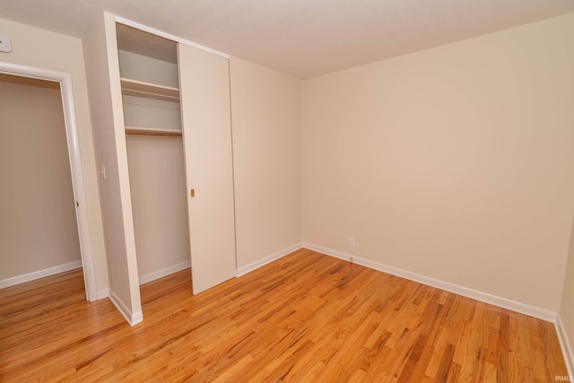 3314 Whitcomb Ave, South Bend, IN 46614 - unfurnished bedroom featuring light wood finished floors, baseboards, and a closet