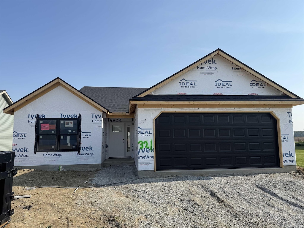 2593 Hogans Aly, Decatur, IN 46733 - property under construction with driveway, a garage, and a shingled roof