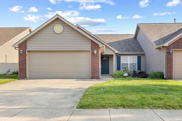 1890 Cal Dr, West Lafayette, IN 47906 - ranch-style house featuring roof with shingles, brick siding, concrete driveway, and an attached garage