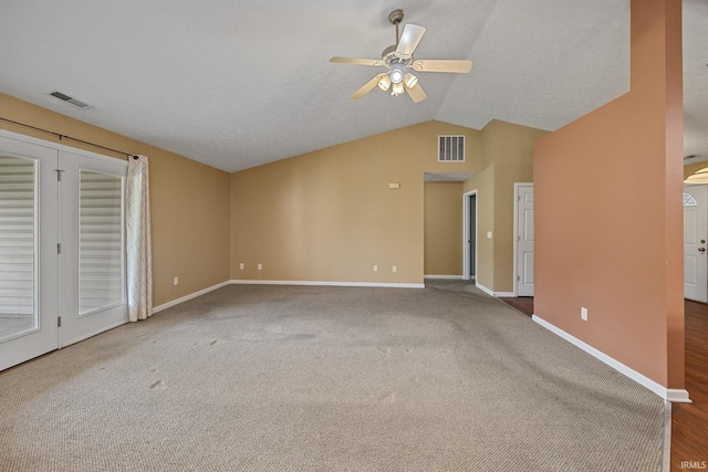 1890 Cal Dr, West Lafayette, IN 47906 - unfurnished living room featuring ceiling fan, vaulted ceiling, baseboards, and carpet flooring