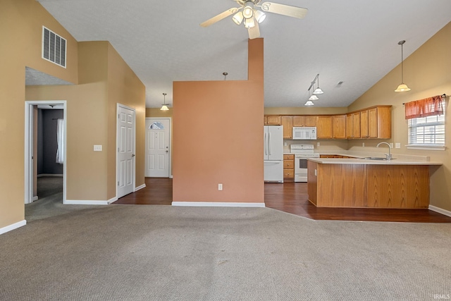 1890 Cal Dr, West Lafayette, IN 47906 - kitchen featuring white appliances, high vaulted ceiling, dark colored carpet, light countertops, and open floor plan