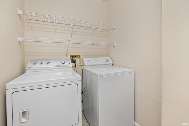 1890 Cal Dr, West Lafayette, IN 47906 - laundry room with separate washer and dryer and baseboards
