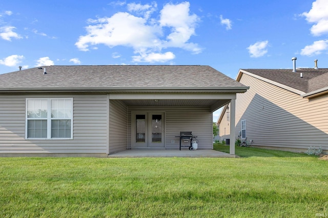 1890 Cal Dr, West Lafayette, IN 47906 - rear view of house with a yard, a patio area, and roof with shingles