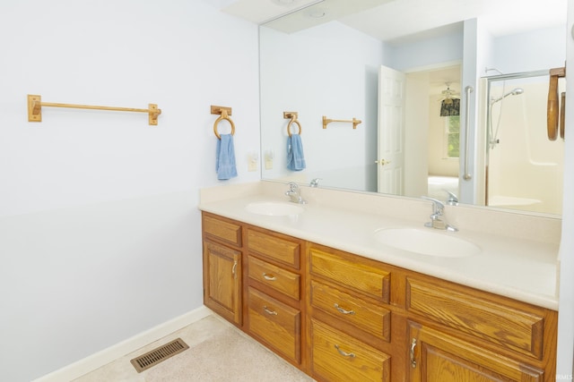 3915 S Allen Ct, Bloomington, IN 47401 - full bath featuring double vanity, a shower with door, and baseboards