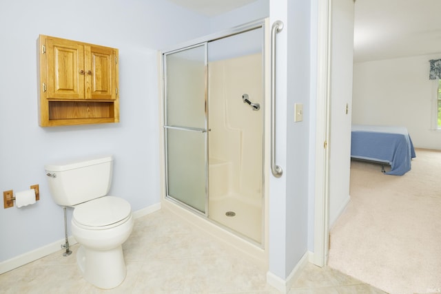 3915 S Allen Ct, Bloomington, IN 47401 - full bathroom featuring a stall shower, toilet, ensuite bath, and baseboards