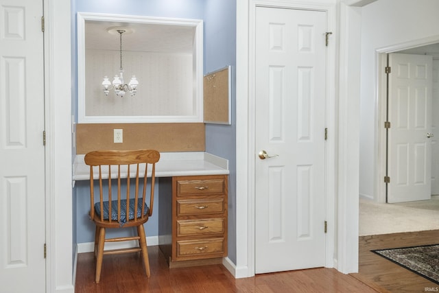 3915 S Allen Ct, Bloomington, IN 47401 - bathroom with wood finished floors, a chandelier, and baseboards