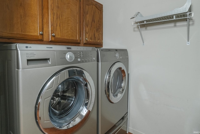3915 S Allen Ct, Bloomington, IN 47401 - washroom featuring cabinet space and washer and dryer